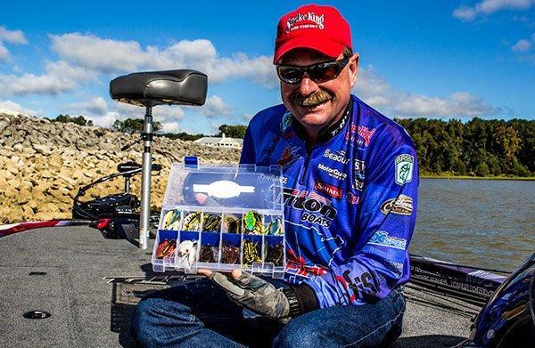 shaw-grigsby-holding-tackle-tray-of-topwater-frogs-for-bass.jpg