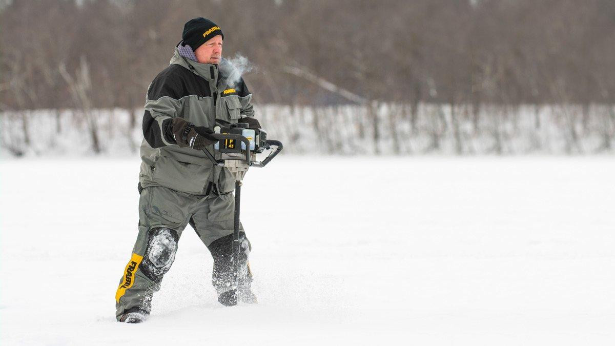 Scott Glorvigen drills holes for ice fishing