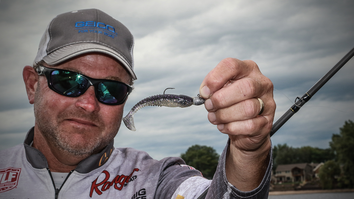 professional angler mike mcclelland holding a bass fishing swimbait