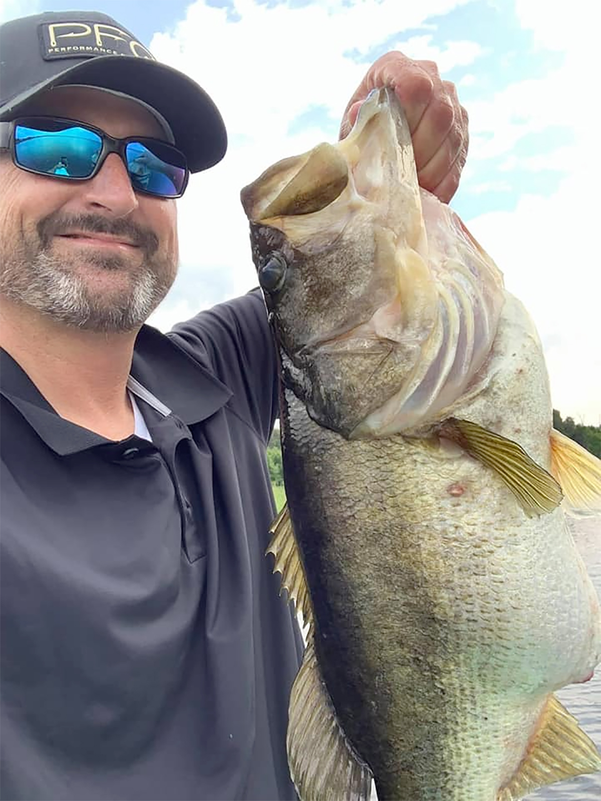 angler holding big bass