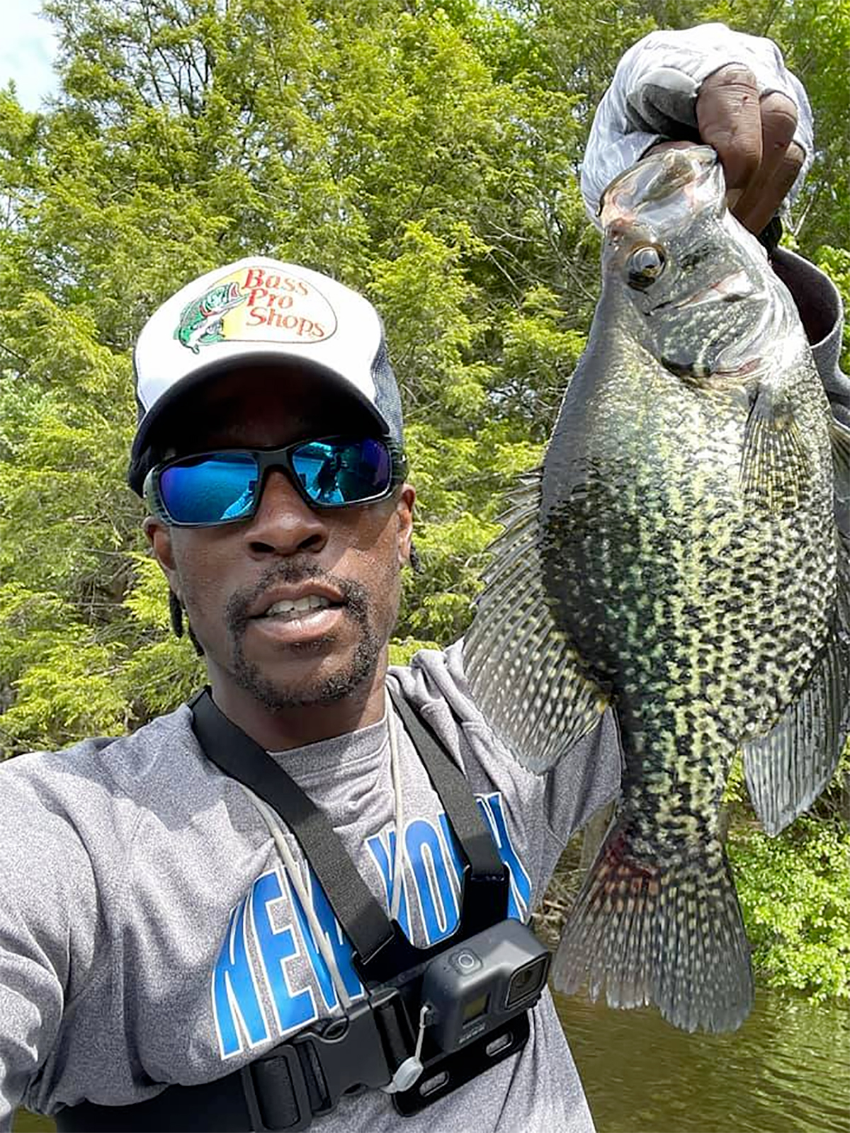 angler holding up a crappie