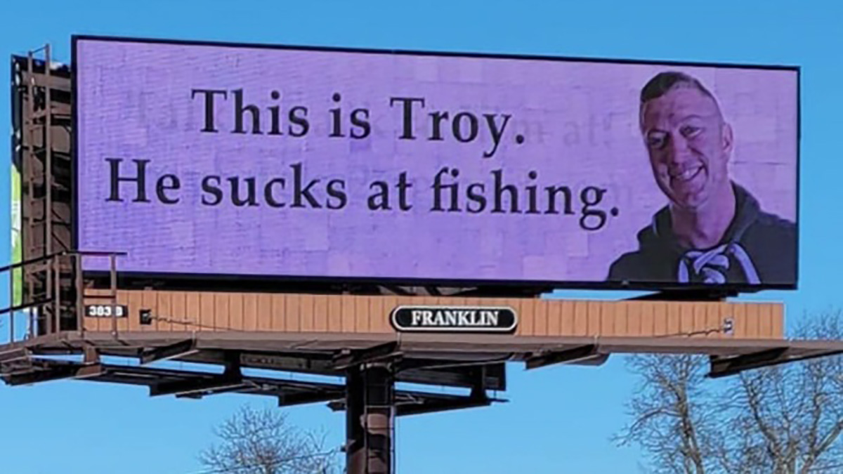 Troy sucks at fishing billboard