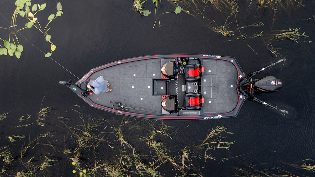 bass fishing boat with power power-pole shallow water anchors deployed