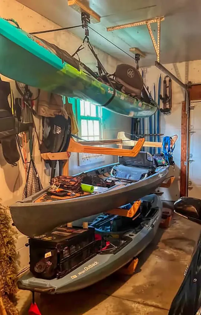 hanging kayak racks in a garage