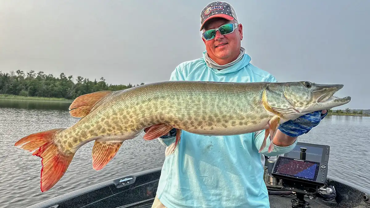 eric naig with a big musky, named vp biz dev for tall pines tackle