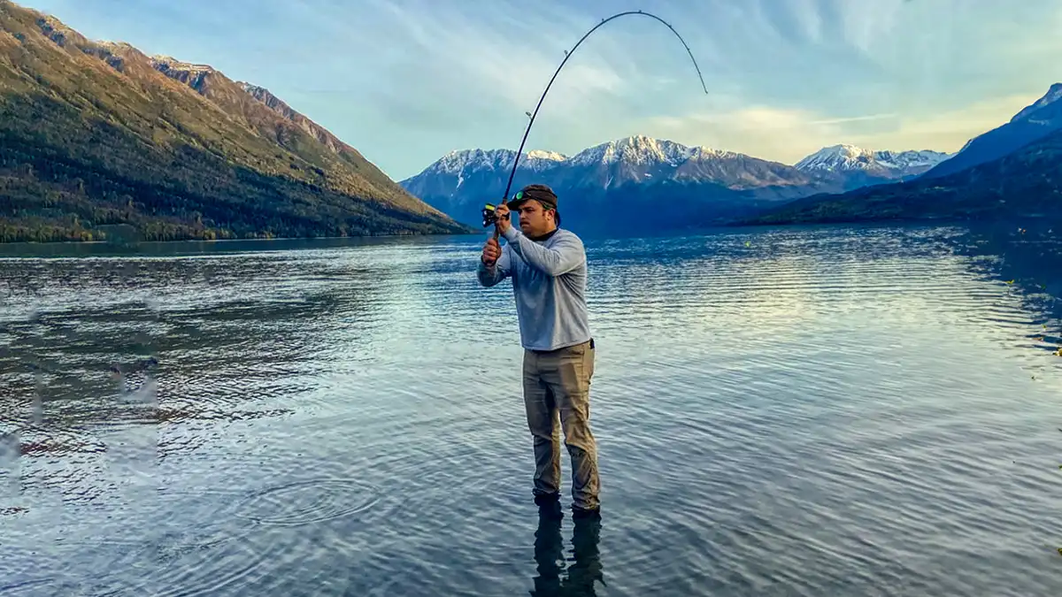 casting in the river in Alaska for trout