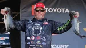 Hank Cherry Signs with Monster Fish Outdoors