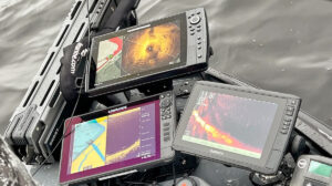 multiple fish finder screens on a boat