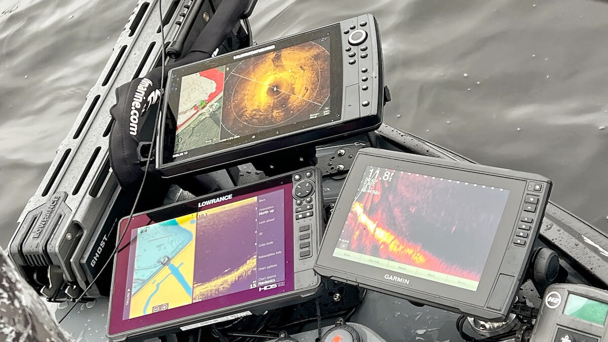 multiple fish finder screens on a boat