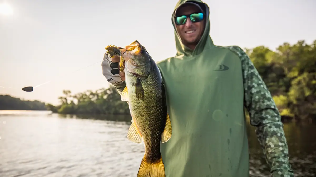 Angler holding up a large bass