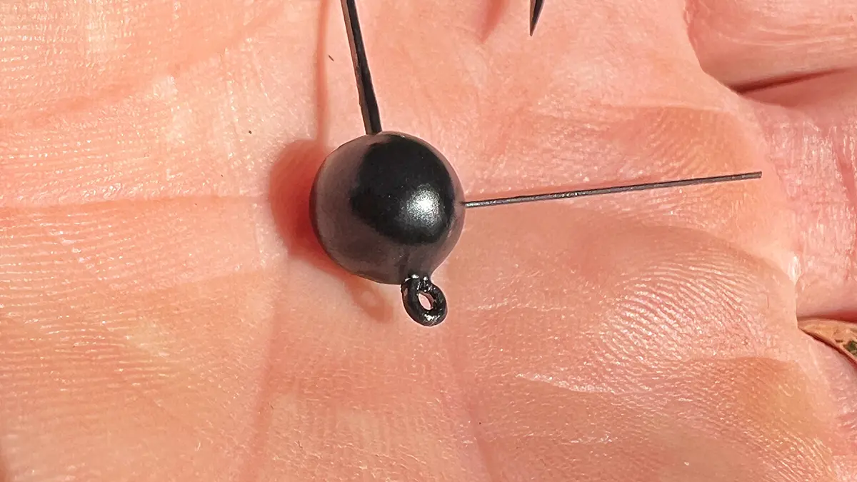 close up in palm of hand WOO Tungsten Wacky Jig Ball