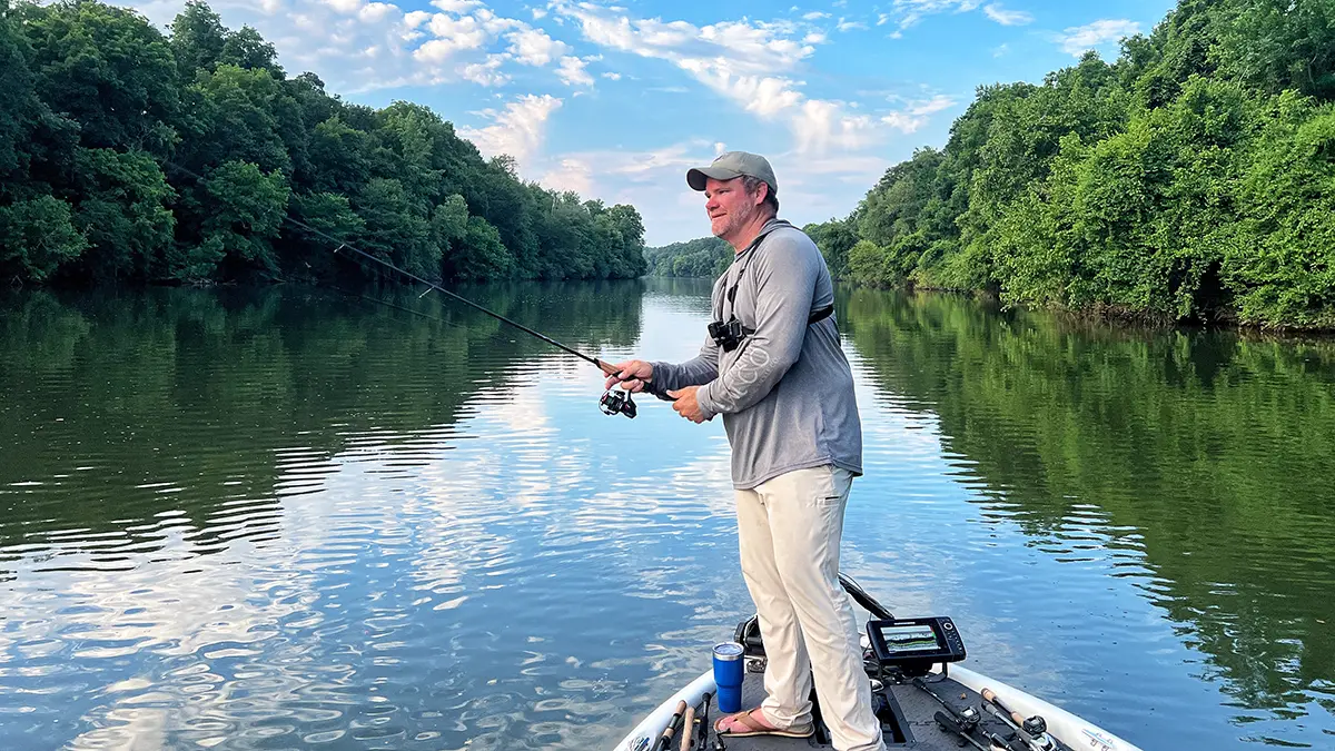 angler on a boat sending bait and rod forward into a cast