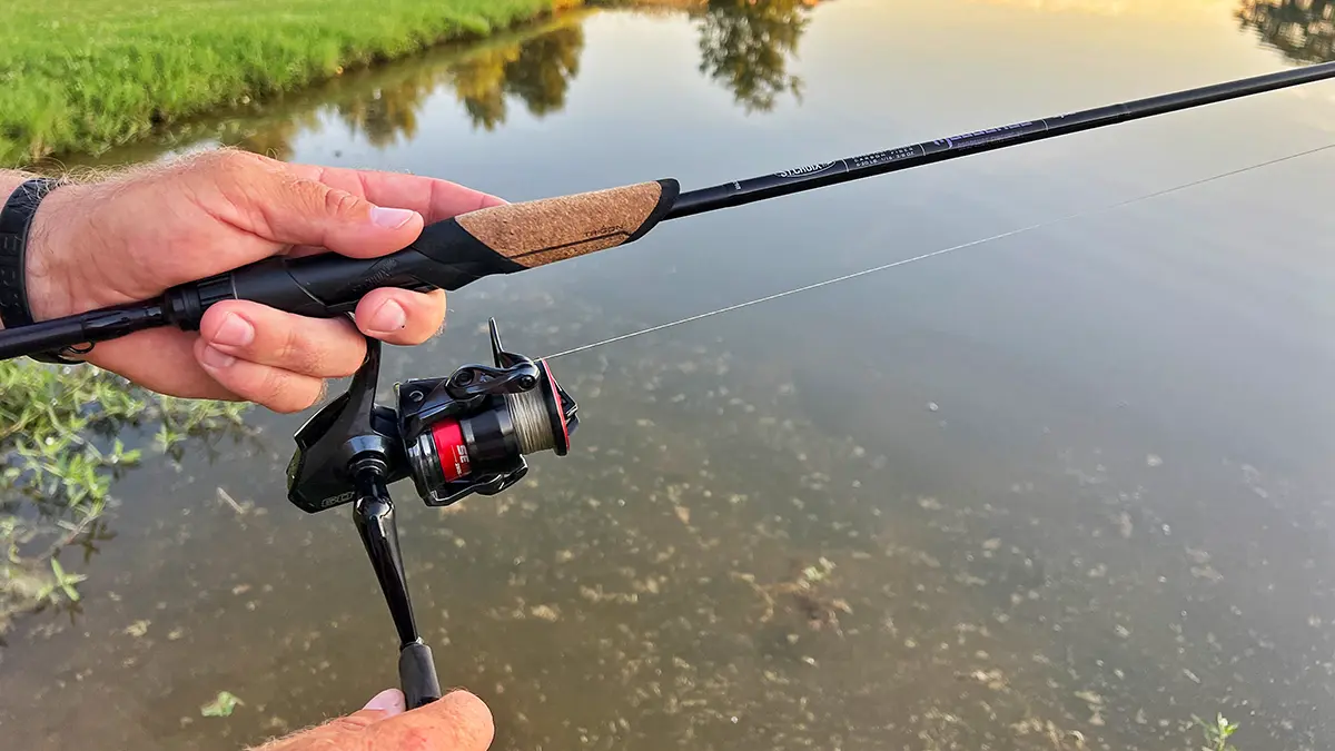 close up of st. croix mojo bass trigon rod with a seviin GS reel, angler is reeling in