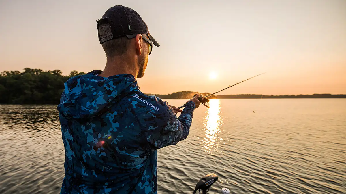 man fishing during sunset