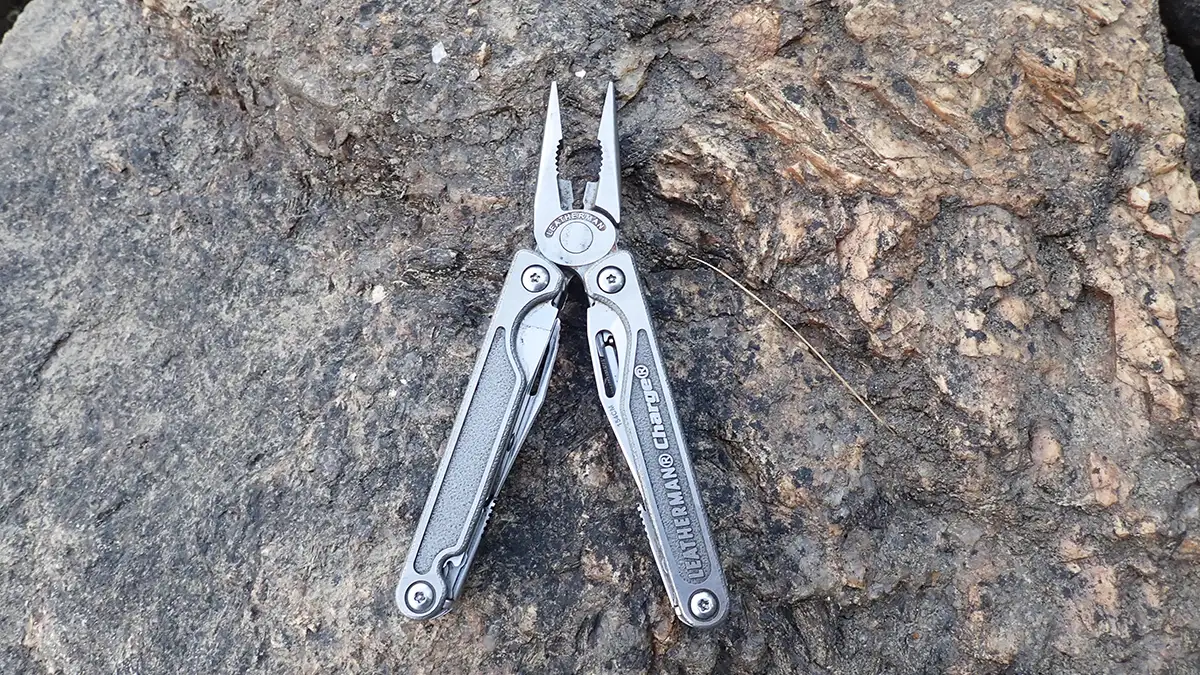 Leatherman Charge + TTI on a rock