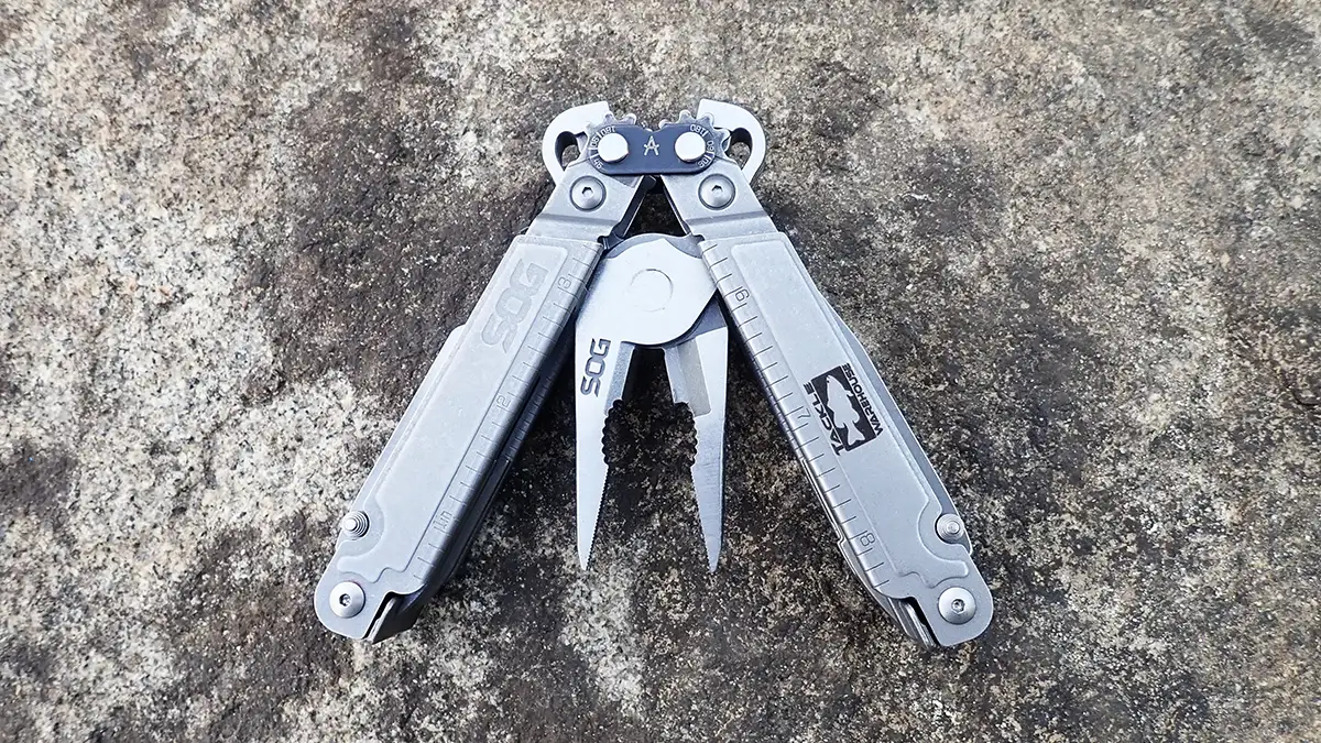 SOG x Tackle Warehouse Power Access Assist Multi-Tool on a rock