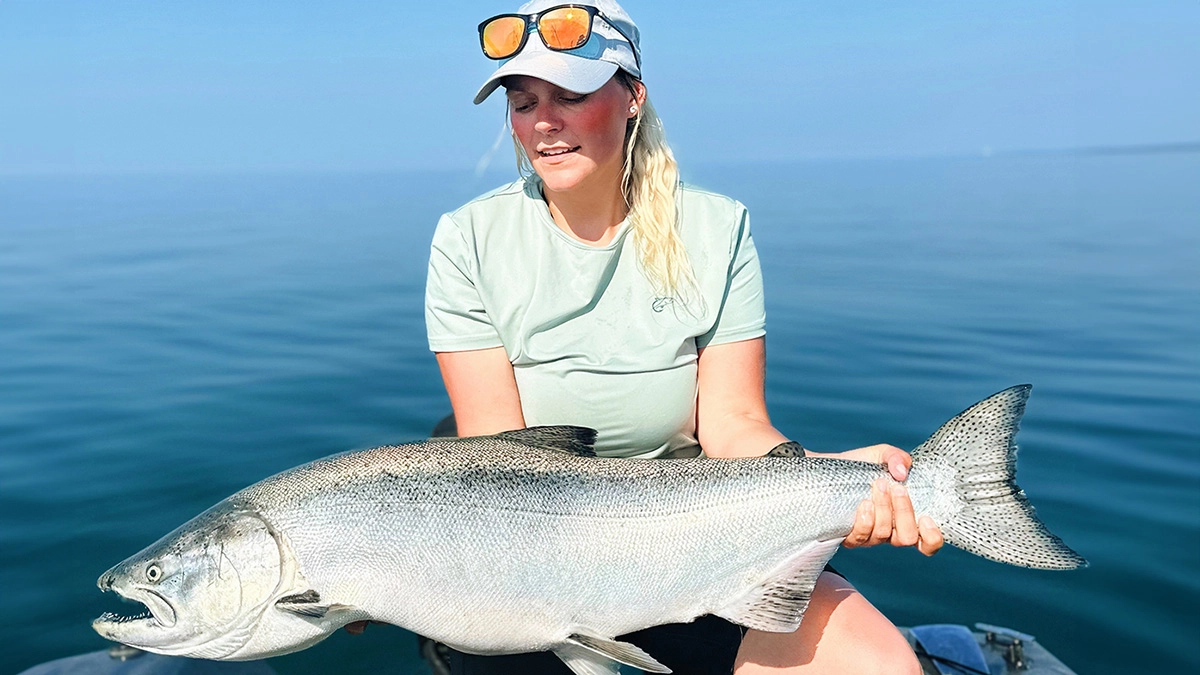 angler with large king salmon