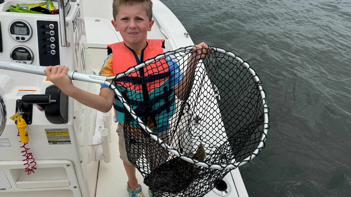 child with summer flounder