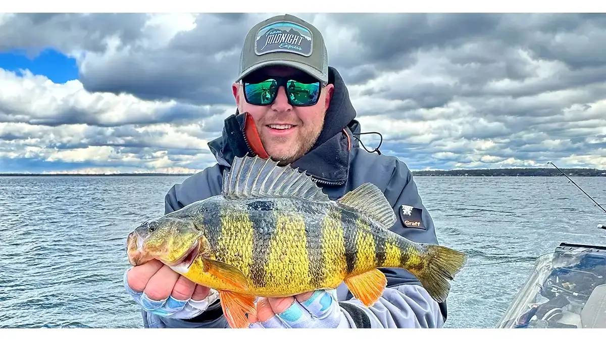 fisherman holding perch (1)