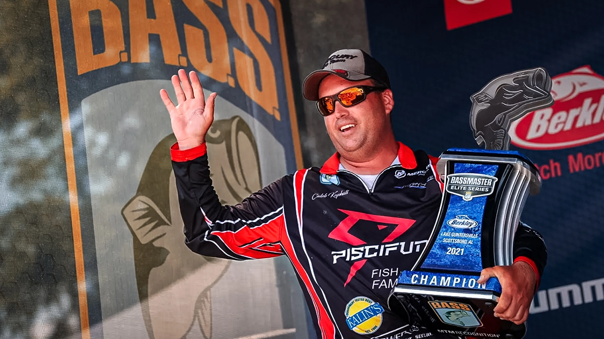 caleb kuphall with bassmaster trophy