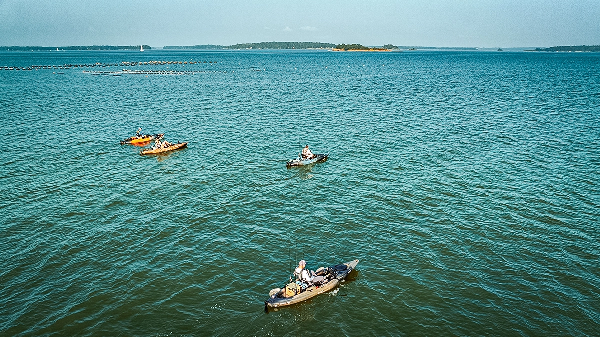 anglers in old town kayaks fishing