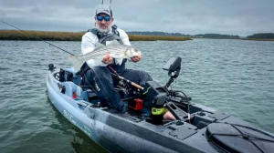 kayak angler with striped bass