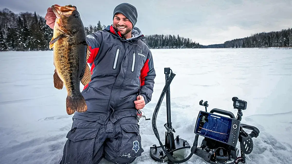 ice angler with bass