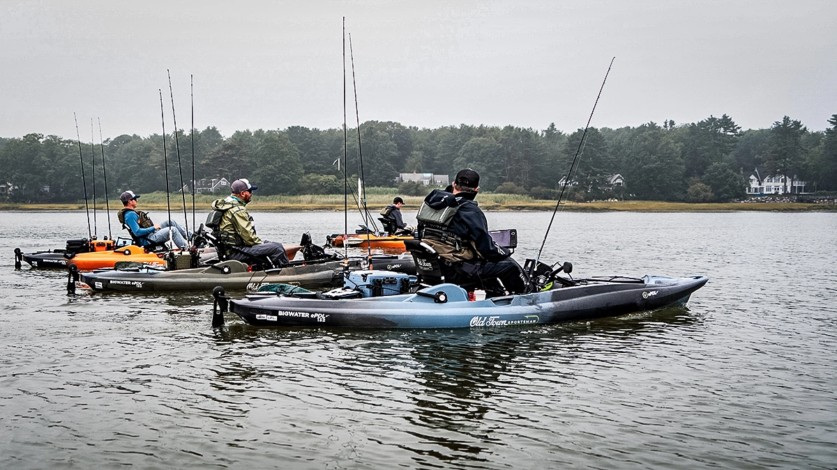 four anglers in old town fishing kayaks