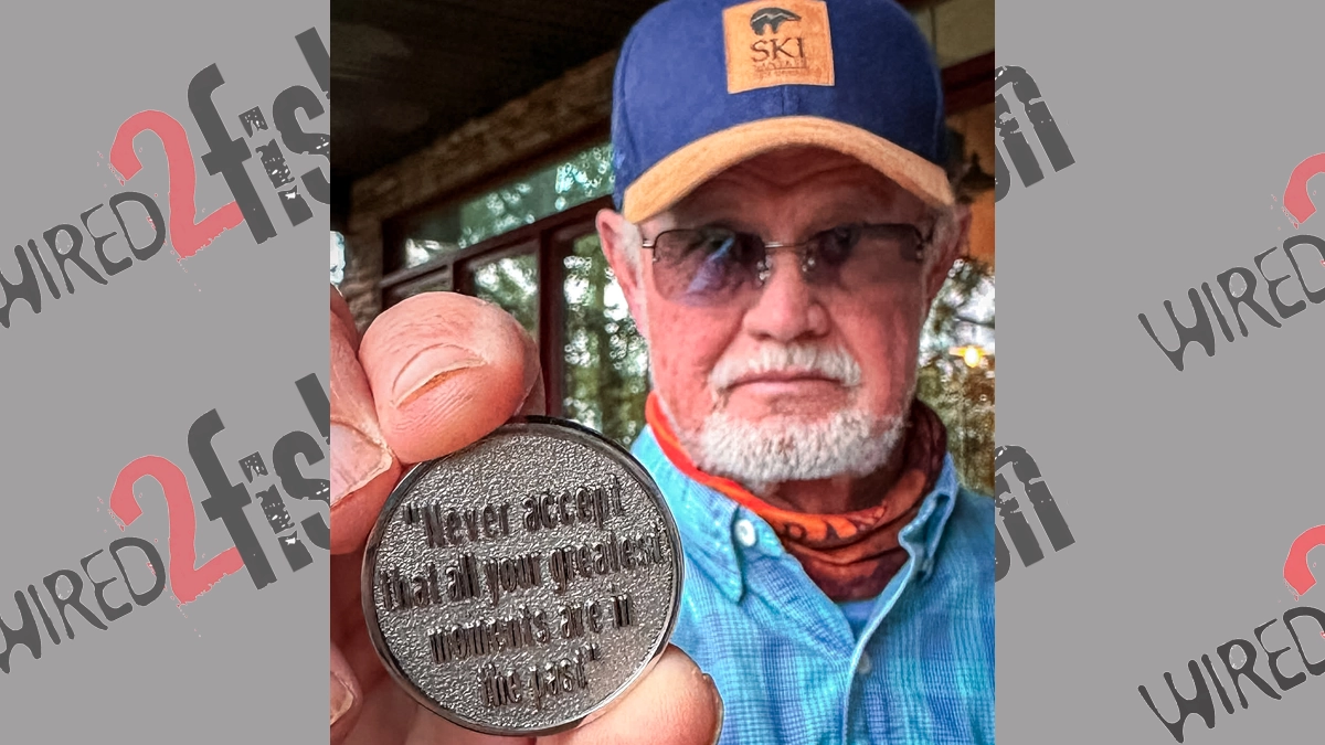 Rick Clunn holding up medal