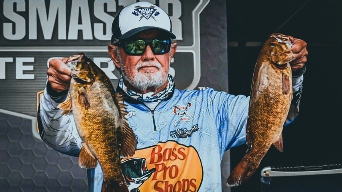 Rick Clunn with two bass