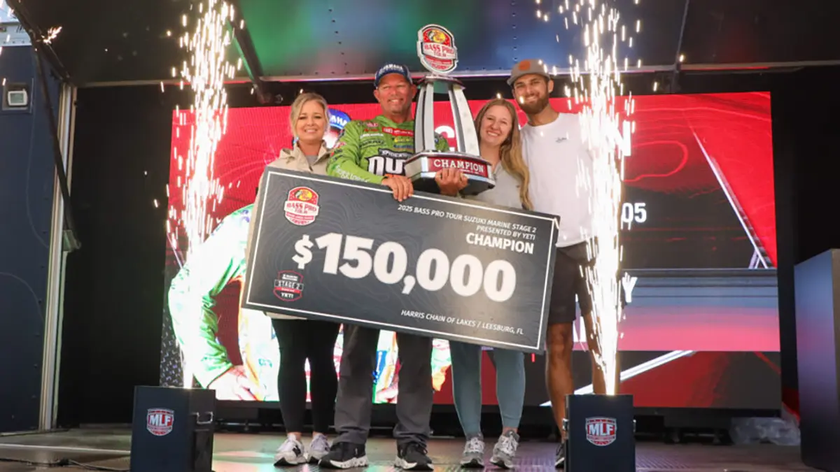 Bobby Lane with trophy on stage