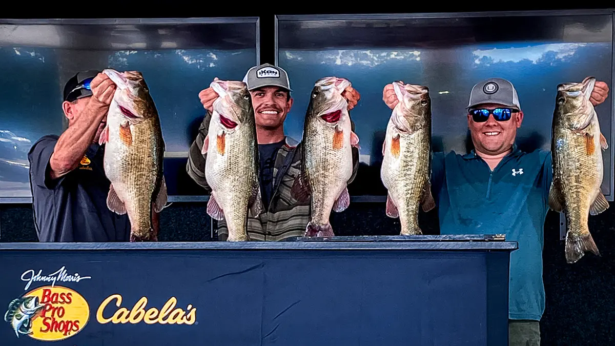 Riley Harris and Luke Potter on stage with their winning fish