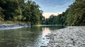 man fishing alone on a secluded river