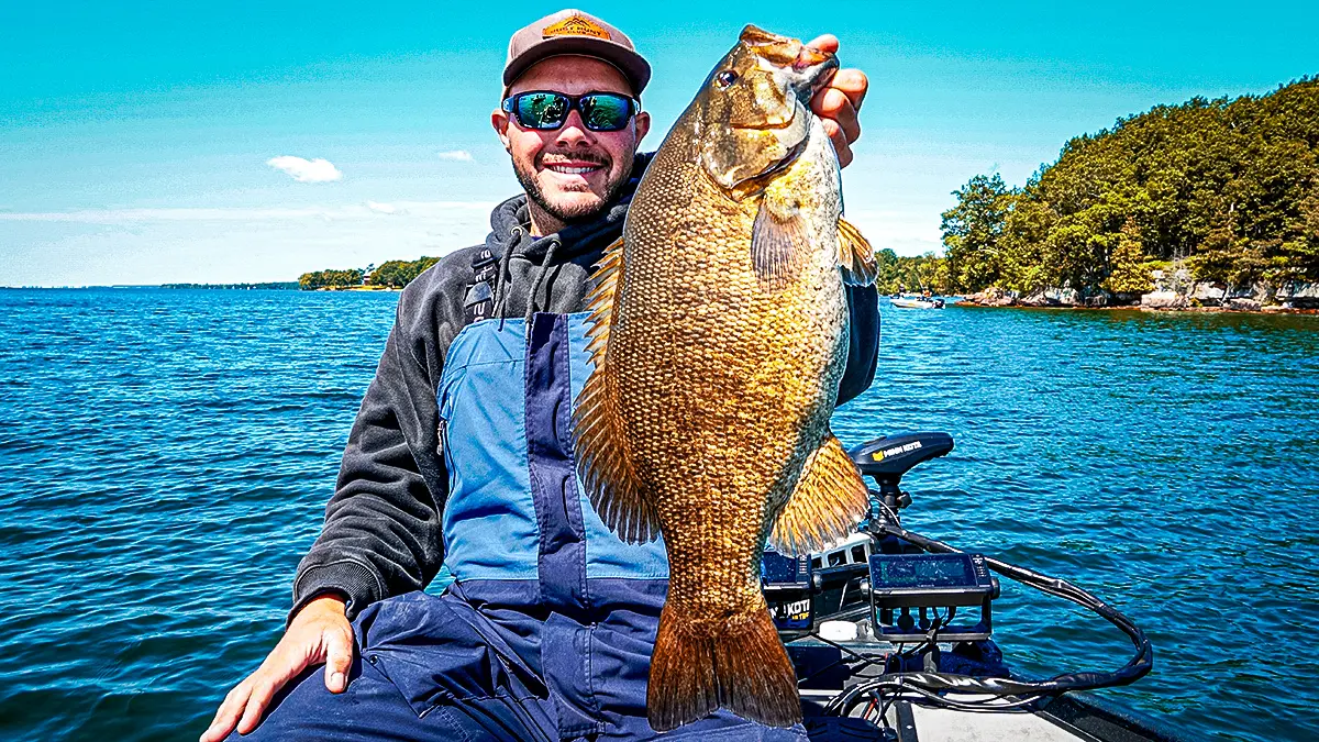  man holding up a largemouth bass