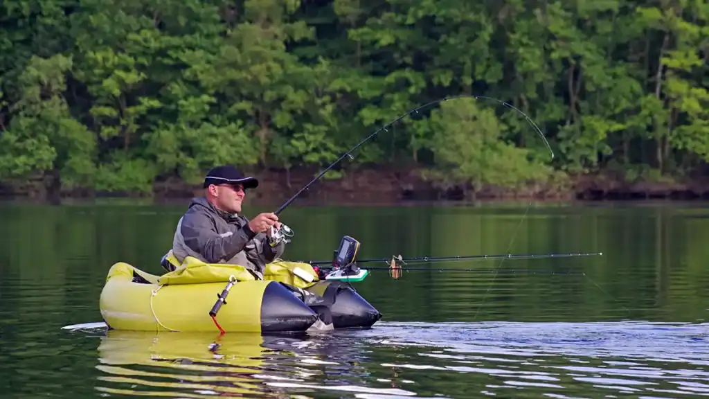 angler fighting fish in float tube